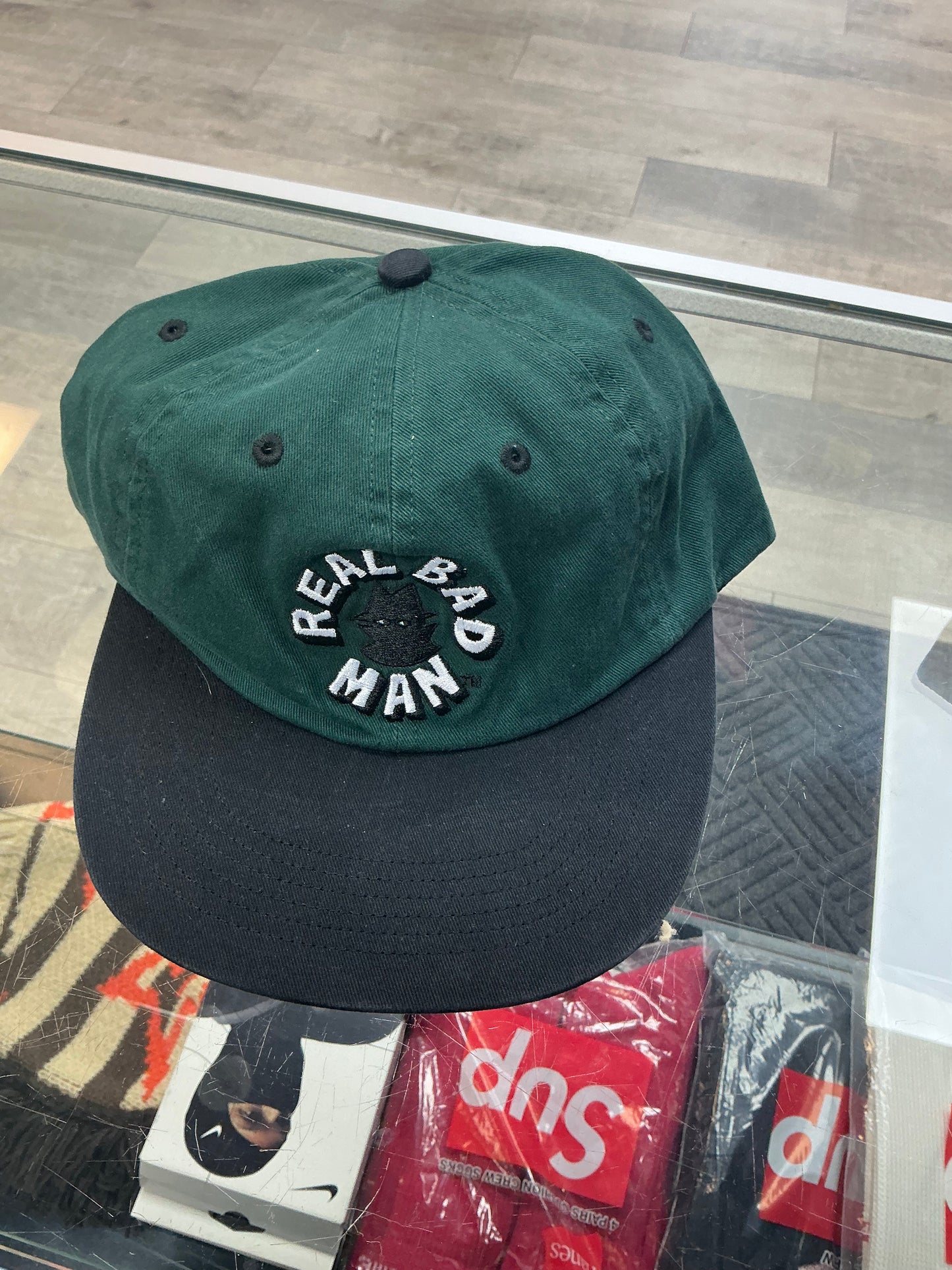 REAL BAD MAN CIRCULAR LOGO HAT